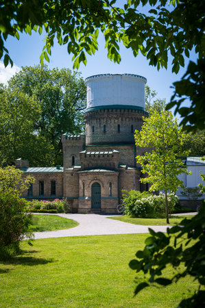 The old observatory in the park Stadsparken in Lund Sweden during summerの写真素材