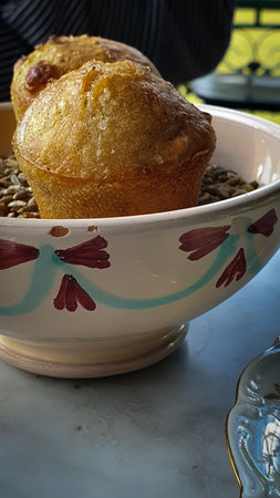 Bread muffin in old fashioned bow on tableの写真素材