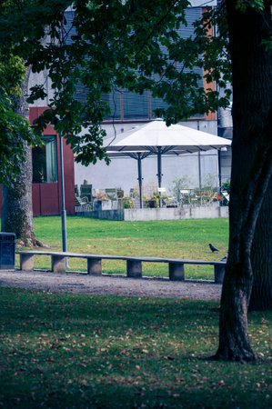Empty outdoor servering area in park environment during autumn in Lund Swedenの写真素材