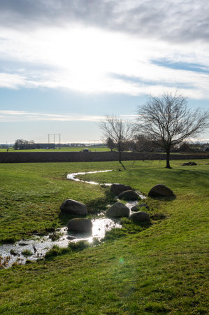 Small stream in rural farmland landscape in SkÃ¥ne (Scania) Sweden during winterの写真素材