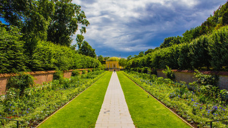 Dramatic sky over symmetry garden in park Pildammsmarken in MalmÃ¶ Sweden during summer
