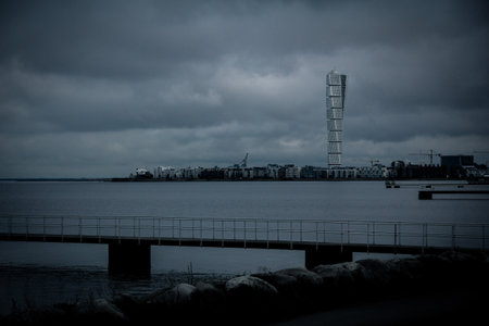 The skyline of MalmÃ¶ Sweden on a dark winter afternoon with storm cloudsの写真素材
