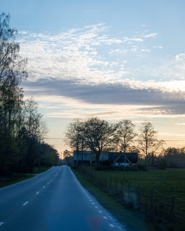 Rural road during sunset in SkÃ¥ne Swedenの写真素材