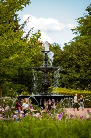 Iron cast fountain in the city park Stadsparken in Lund Sweden in summer dayの写真素材