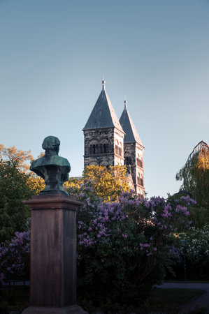 Cathedral surrounded by lush green plants and flowers
