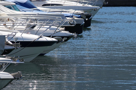 Line of expensive yachts docked at a marinaの写真素材