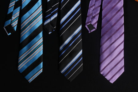 colorful ties for men on black background