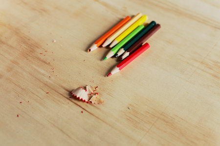 Colored pencils on a wooden board. with pig cutterの写真素材