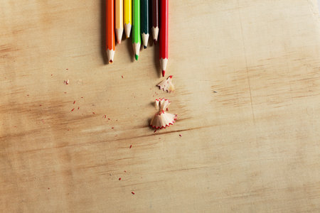 Colored pencils on a wooden board. with pig cutterの写真素材