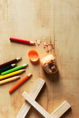 Colored pencils on a wooden board. with pig cutterの写真素材