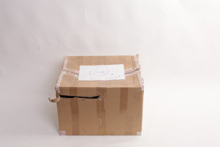 Fragile box damaged isolated on white.の写真素材