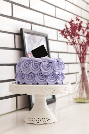 Buttercream birthday cake over white background,gain, film grain, shallow dof, high-iso