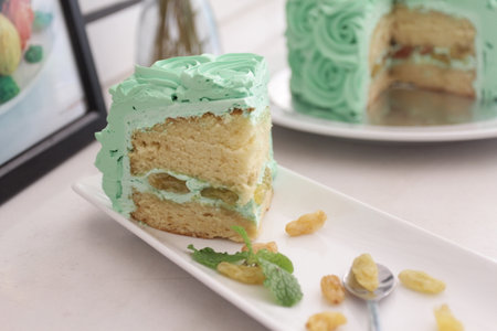 Piece Buttercream birthday cake over white background.の写真素材