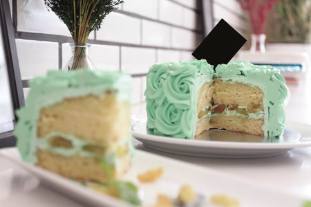 Piece Buttercream birthday cake over white background.の写真素材