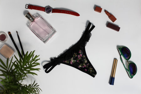 Shopping and fashion concept. Set of glamorous stylish sexy lace lingerie, woman accessories on wooden backgroundの写真素材