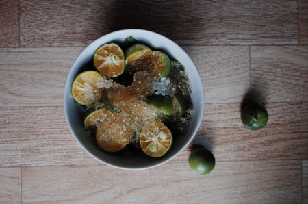 Healthy drink with fresh leaves, lemon, honey and sugarの写真素材