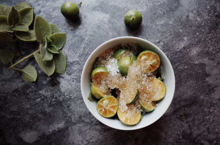 Healthy drink with fresh leaves, lemon, honey and sugarの写真素材