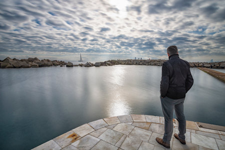 Contemplating the sea cloudy day