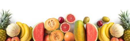 Variety of fresh seasonal fruits on white background, panoramic view, copy spaceの写真素材