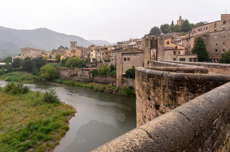 Medieval village in the rain, view of the river from a bridgeの写真素材