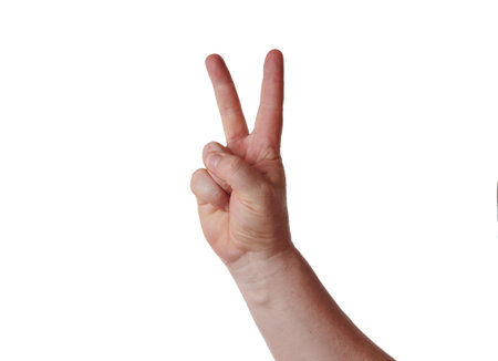 Man hand with V-shaped fingers on white backgroundの写真素材