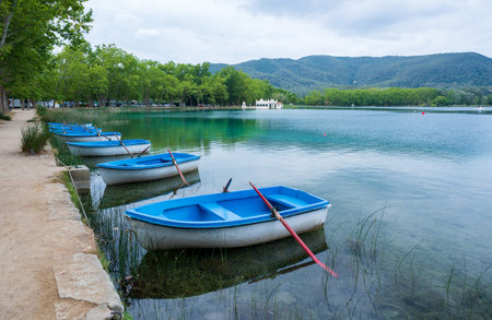 Landscape with boats in the lake of BaÃ±olas, Spainの写真素材