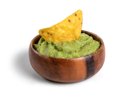 bowl with guacamole and nachos isolated on the white backgroundの写真素材