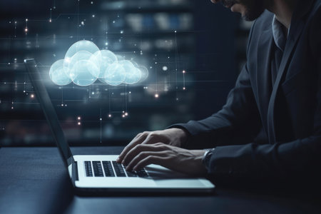 Businessman is using a laptop to access the cloud computing systemの素材