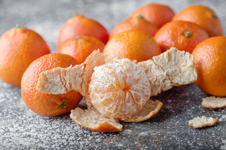 tangerines, peeled tangerine and tangerine slicesの写真素材
