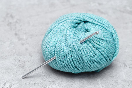 crochet hook with a ball of wool yarnの写真素材