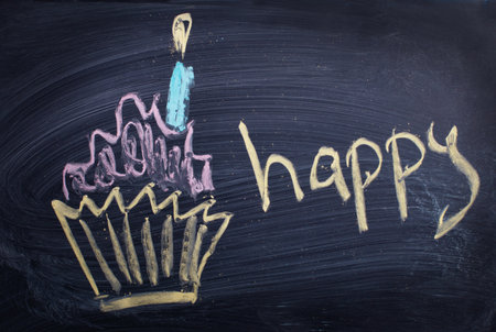 Children drawings on school blackboard  birthday cake