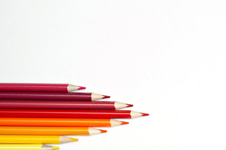 Close-up of set of colorful pencils on white background with copy spaceの写真素材