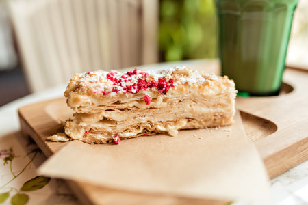 delicious slice of puff pastry with cream close-upの写真素材