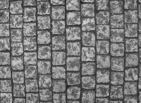 Stone pavement texture. Granite cobblestoned pavement background. Abstract background of old...
