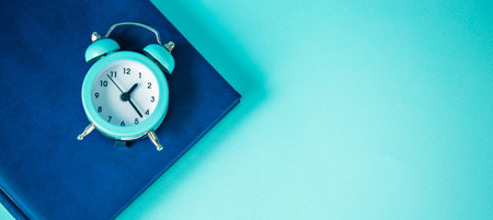 Time management concept: blue watch and notepadの写真素材
