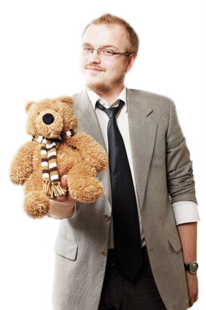 portrait of a good man in eyeglasses with teddy bearの写真素材