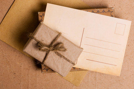 present gift from grunge paper with postcardの写真素材