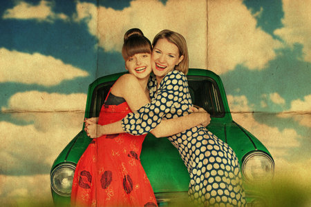 happy young women with retro car, vintageの写真素材