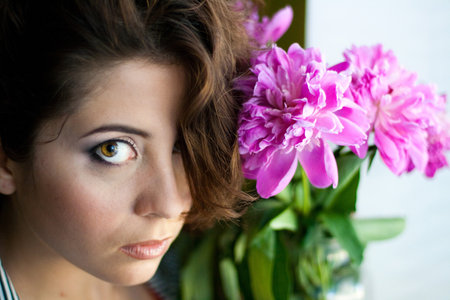 beautiful woman with peonies の写真素材
