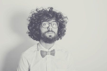 desaturated art photo with handsome man, curly hairsの写真素材