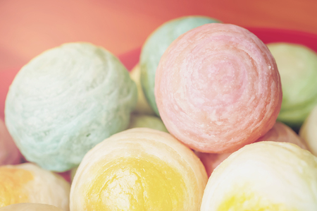 Chinese ancient dessert called 'Pia',ancient dessert Made from flour to Baking heat Mashed golden beans stuffed with salted egg yolk,Chinese pastry, Traditional delicious moon cake in asia,pastel colorの写真素材