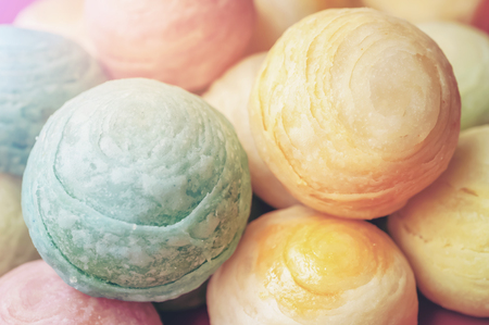 Chinese ancient dessert called 'Pia',ancient dessert Made from flour to Baking heat Mashed golden beans stuffed with salted egg yolk,Chinese pastry, Traditional delicious moon cake in asia,pastel colorの写真素材