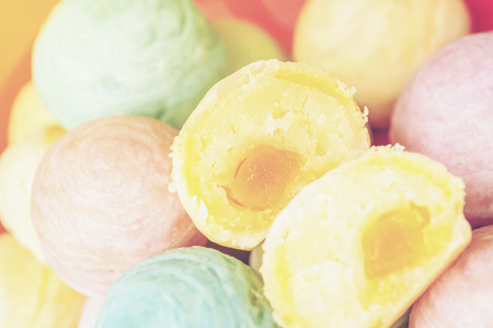 Chinese ancient dessert called 'Pia',ancient dessert Made from flour to Baking heat Mashed golden beans stuffed with salted egg yolk,Chinese pastry, Traditional delicious moon cake in asia,pastel colorの写真素材