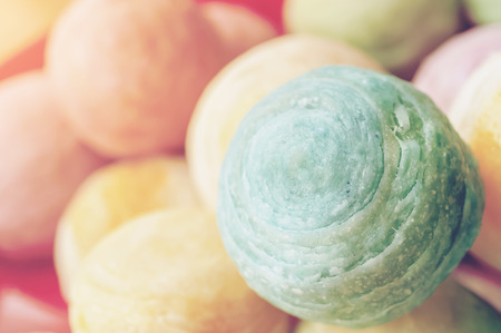 Chinese ancient dessert called 'Pia',ancient dessert Made from flour to Baking heat Mashed golden beans stuffed with salted egg yolk,Chinese pastry, Traditional delicious moon cake in asia,pastel colorの写真素材
