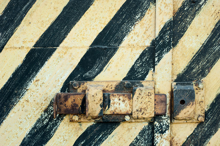 Old rusty metal door with peeling paint. Vintage textureの写真素材