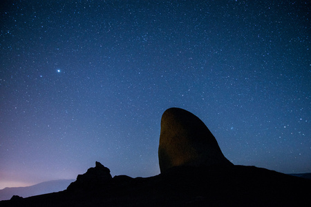 The starry sky above the mountains peaksの写真素材