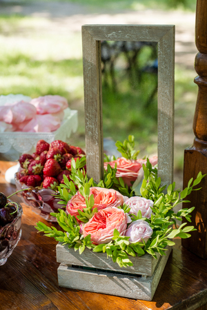 Festive table setting with flowers, fruit and marshmallows. Wedding decor.の写真素材