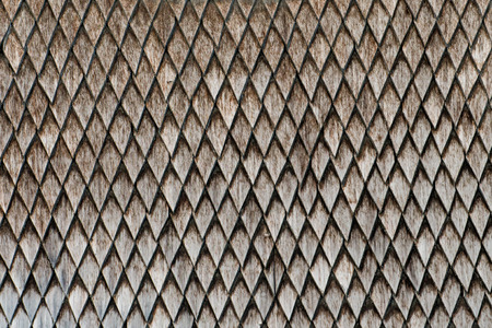 Old weathered wooden wall with ornament. Vintage texture Background.の写真素材