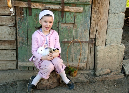 Little girl play with her rabbitの写真素材