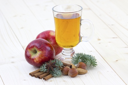 glass of apple juice, fresh fruits and spicesの写真素材